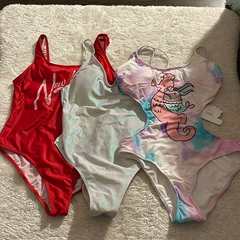 Lot of three one-piece swimsuits
